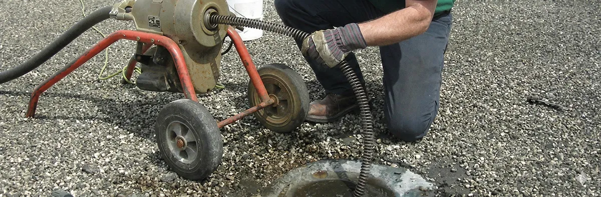 sewer rodding technician actively removing blockages from a sewer line in Chandler, AZ